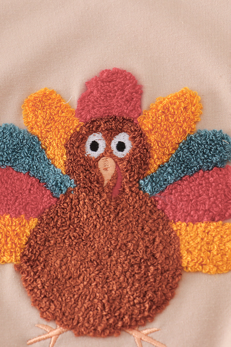 Beige turkey french knot ruffle top- In stock